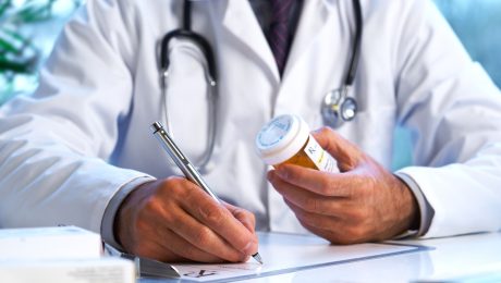 Doctor writing out RX prescription